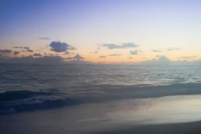 Gentle waves and a colorful ocean sunrise in Punta Cana.

Photo: Meg von Haartman / Unsplash